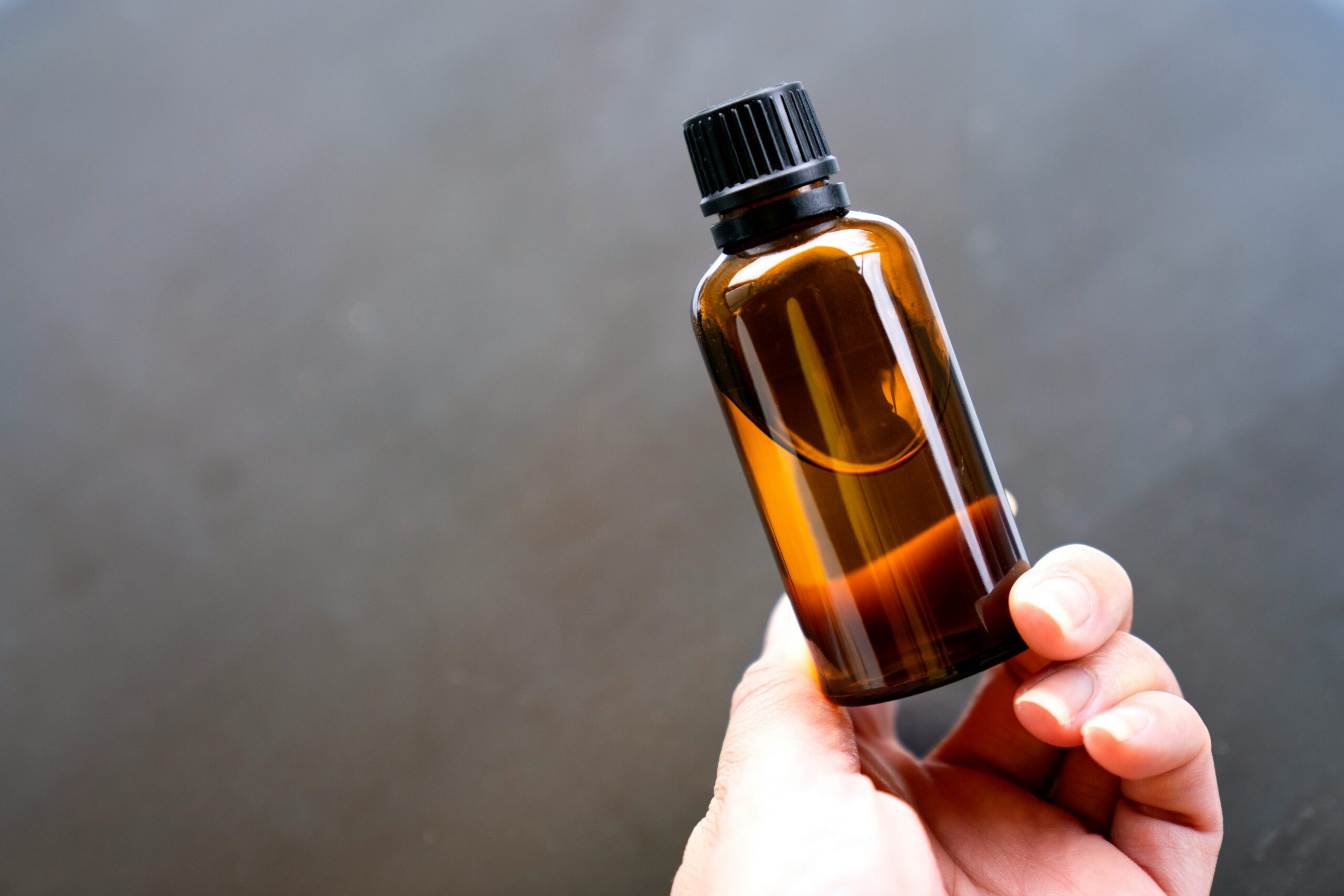 anointing oil in hand